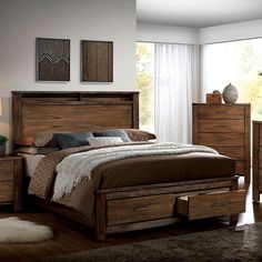 a bedroom scene with focus on the bed and dresser