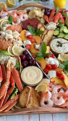 a platter filled with seafood and veggies