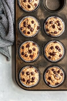 a muffin tin filled with chocolate chip cookies