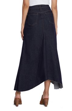 This updated jean skirt is designed in a pieced longline silhouette with a feathery fringed hem. 30 1/2" to 33" length (size 29) Unlined 72% cotton, 16% polyester, 1% spandex, 11% rayon Machine wash, tumble dry Imported Dark Wash Fitted Denim Skirt With Asymmetrical Hem, Asymmetrical Hem Denim Skirt, Denim Blue Asymmetrical Hem Skirt, Dark Wash Asymmetrical Skirt With Frayed Hem, Denim Skirt With Frayed Asymmetrical Hem, Asymmetrical Denim Skirt With Frayed Hem, Chic Asymmetrical Denim Skirt With Frayed Hem, Fitted Asymmetrical Denim Skirt With Frayed Hem, Asymmetrical Denim Blue Skirt With Frayed Hem