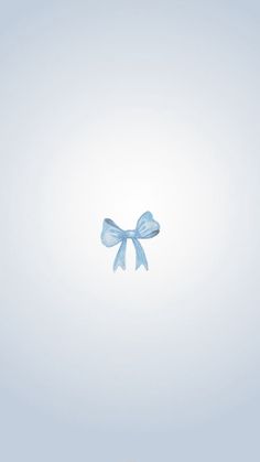 a blue bow is floating in the air