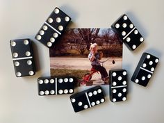 some dices are laying next to a photograph of a man with a tennis racket