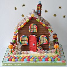 a gingerbread house decorated with candy and candies