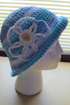 This crochet bucket style hat with interchangeable flower is handmade with 100% cotton yarn. -The hat's color is various shades of blue  -This crochet womens sun hat is made to fit a teen or adult head circumference -Make a fashion statement while keeping your head cool and protected when wearing this handmade cotton sun hat as a stylish crochet beach hat! Affordable Blue Summer Hats, Cheap Blue Summer Hats, Cheap Blue Summer Sun Hat, Cheap Blue Sun Hat For The Beach, Cheap Blue Hats For Beach Season, Playful Blue Affordable Sun Hat, Cheap Blue Hats For Vacation, Cheap Blue Vacation Hats, Cheap Blue Crochet Cap