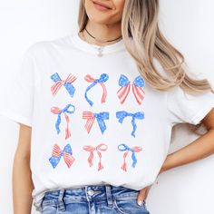 Cozy oversized Comfort Colors T-Shirt with USA Bows Coquette Graphic - perfect for the Fourth of July, or Memorial Day! FEATURES * Comfort Colors - 6.1 oz., 100% ringspun cotton t-shirt * Preshrunk, soft-washed, garment-dyed fabric * Design is printed with water-based ink on a white tee * Printed with a direct to garment printer (DTG) - ink is printed into the fibers of the fabric for long-lasting wear that never fades! * Fast shipping (3-5 business days) * Beautifully packaged, and ready to gif Cute Cotton T-shirt For 4th Of July, Cute American Flag Print Short Sleeve T-shirt, Cute Independence Day T-shirt With Graphic Print, Cute Independence Day Graphic Print T-shirt, Cute Independence Day Graphic T-shirt, Cute Crew Neck T-shirt For Independence Day, Cute Crew Neck Shirt For 4th Of July, Cute Short Sleeve Tops For Independence Day, Cute Cotton Independence Day Top