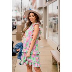 If you are a person who loves bold clothing, this dress is for you! The bright colors paired with the floral print and ruffles makes such a fun, unique look! Self & Lining: 100% Polyester Hand Wash Cold. Do Not Bleach. Low Iron. Do Not Dry Clean. Line Dry. Green Floral Ruffled Dress For Beach, Green Floral Ruffled Dress For The Beach, Green Floral Dress With Ruffles For Beach, Casual Tiered Ruffle Floral Dress, Green Floral Dress With Ruffles For Summer, Casual Tiered Floral Dress With Ruffles, Playful Floral Print Vacation Dresses, Floral Print Ruffle Sundress For Spring, Playful Floral Print Dress For Vacation