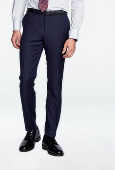 Classic, versatile and reliable - the Hemsworth is your tried-and-true navy pants. This solid-colored number in pure premium wool stands up to whatever the daily hustle throws at you. Navy Fitted Dress Pants For Business Casual, Fitted Navy Dress Pants For Business Casual, Fitted Navy Straight Dress Pants, Fitted Full-length Navy Dress Pants, Navy Fitted Dress Pants For Work, Navy Elegant Tapered Leg Dress Pants, Elegant Navy Bottoms For Business Casual, Elegant Navy Tapered Leg Dress Pants, Navy Slim Fit Pants For Business Casual