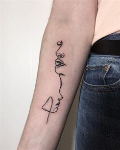 a woman's arm with a line drawing on the left side of her arm