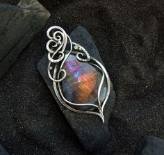 Elven style labradorite necklace with a beautiful finnish spectrolite of a beautiful rainbow color. Silver pendant - a wonderful gift to your wife, daughter, mother, sister!  * * * *  Labradorite - stone of love and fulfillment of desires! This mineral will help to discover the purpose, to show the talents inherent in nature, parents, to climb the career ladder, to fulfill the innermost desires, to find love. The product is patinated and polished. silver, labradorite Size: 4.5  cm 1.77 * * * * * Iridescent Labradorite Pendant Necklace, Iridescent Labradorite Pendant Jewelry, Unique Silver Labradorite Necklace, Silver Labradorite Necklace With Wire Wrapped Details, Handmade Iridescent Labradorite Necklace, Labradorite Cabochon Pendant Necklace, Iridescent Labradorite Necklace For Gift, Gift Iridescent Labradorite Necklace, Elven Style