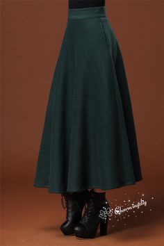 "Detail Info: ❤ Color: dark green ❤ Material: woolen Size XS: Waist: 63cm / 24.8\" Length: 85cm / 33.46\" Size S: Waist: 66.7cm / 26.26\" Length: 85cm / 33.46\" Size M: Waist: 70cm / 27.5\" Length: 85cm / 33.46\" Size L: Waist: 73.30cm / 28.86\" Length: 85cm / 33.46\" Size XL: Waist: 76.67cm / 30.19\" Length: 85cm / 33.46\" Size XXL: Waist: 80cm / 31.50\" Length: 85cm / 33.46\" Custom size please tell us your waist size, hip, and length you want 70-95cm is optional. ❤ Care: machine wash cold and Green Long Winter Skirt, Winter Long Green Skirt, Green Long Skirt For Winter, Long Green Skirt For Fall, Fall Green Lined Maxi Skirt, Green Lined Maxi Skirt For Fall, Green Pleated Maxi Skirt For Fall, Green Lined Skirt For Fall, Green Winter Midi Skirt