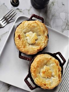 two pies sitting on top of a white plate