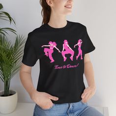 Get Your Groove On in Our Time to Dance T-Shirt | Sparkle on the Dance Floor | Stylish Time to Dance T-Shirt 🌟 Get Ready to Shine with Our Time to Dance T-Shirt! 🌟 Step into the spotlight and let your passion for dance take center stage with our stylish Time to Dance T-Shirt. Whether you're hitting the dance floor, joining a dance class, or just expressing your love for rhythm and movement, this t-shirt is your perfect partner. Designed for dance enthusiasts, this tee combines comfort, style, Pink Hip Hop Top With Screen Print, Hip Hop Pink Tops With Screen Print, Hip Hop Style Pink Tops With Screen Print, Fitted Black Top For Dance Class, Short Sleeve Graphic Print Shirt For Dance, Graphic Print Short Sleeve Shirt For Dance, Short Sleeve Tops With Graphic Print For Dance Class, Short Sleeve Graphic Print Tops For Dance, Short Sleeve Shirt With Graphic Print For Dance