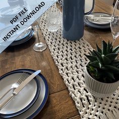 the table is set with plates, silverware and a blue vase on it that says diy kit make your own