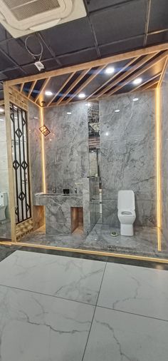 a bathroom with marble walls and flooring