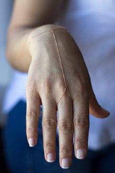 14K Gold Hand Chain / Minimalist Hand Bracelet/Shahmaran Hand Bracelet 14 K Gold includes 1 cm extension ring Weight: ~1.10 gr Please measure your wrist dimension as instructed at photo. Don't put extra measure on exact wrist size. No need ring size for this bracelet. Ring part is large to fit all. Shahmaran should be a little loose or it will break when the chain is stretched. at first it might feel a little uncomfortable, but the structure of the shahmaran is like that. Don't wear while sport, sleeping, playing with kids. We do not have any warranty or refund if it does not fit or i its broke. Please follow care instructiondocument  shared with our product. Free Fedex Express Shipping 2-7 business days to Worldwide ✦ Registered mail which require a signature ✦ We extremly need your phone Ring With Bracelet Attached, Silver Hand Chain, Gold Hand Chain, Mood Jewelry, Star Necklace Silver, Pearl Heart, Solid Gold Chains, Hand Bracelet, Wear Necklaces