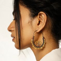 The Aria Athena Hoops feature a Greek fusion of design with Indian traditional jewelry elements in a modern hoop fashion. The two-toned plating allows for a versatile styling idea. Gifting: This choker set comes in a beautiful Yamoona gift box, making it an ideal gift for birthday, wedding anniversary or wedding gift. Occasion: Perfect choice for any Indian occasion, festivals, parties, dances, and weddings Care: We recommend you protect your silver jewellery and increase the longetivity of the plating by placing the jewelry in a fabric pouch and storing it in a cool, dry place, keeping individual pieces separate to avoid scratching. Also to maintain the best condition of your jewellery remove when showering, swimming or when undertaking manual or domestic work. Free Shipping on Orders ove Elegant Oxidized Brass Hoop Earrings, Oxidized Finish Chandbali Hoop Earrings, Elegant Brass Hoop Earrings With Oxidized Finish, Elegant Gold Hoop Earrings With Oxidized Finish, Round Chandbalis For Festival, Elegant Oxidized Chandbali Hoop Earrings, Bohemian Chandbalis For Wedding, Bohemian Round Chandbalis For Wedding, Bohemian Style Round Chandbalis For Weddings