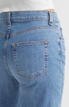 Wide legs and raw hems bring retro-chic style to fashionably faded jeans kept comfortable with a bit of stretch. 27" inseam; 19" leg opening; 11" front rise; 14" back rise (size 29) Zip fly with button closure Five-pocket style 98% cotton, 2% polyurethane Machine wash, line dry Made in the USA of imported fabric Washed Blue Fitted Cropped Jeans, Fitted Washed Blue Cropped Jeans, Classic Straight Leg Flare Jeans With Frayed Hem, Classic Denim Blue Bottoms With Frayed Hem, Fitted Cutoff Flare Denim Jeans, Classic Denim Blue Flare Jeans With Frayed Hem, Classic Denim Flare Jeans With Frayed Hem, Classic Flare Jeans In Denim Blue With Frayed Hem, Classic Cropped Flare Jeans With Frayed Hem