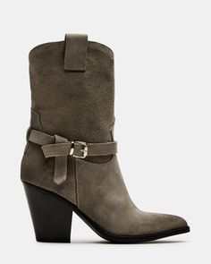 Step into style with the HARDY bootie. Featuring a pointed toe and stacked wood heel, this western-inspired boot also includes a buckle detail and pull tabs. Perfect for any look, these boots are sure to add an edgy touch to your wardrobe. 3 inch heel height 12.25 inch shaft circumference 7.5 inch shaft height Suede upper material Synthetic lining Synthetic sock Synthetic sole Imported Chic Boots With Stacked Heel For Rodeo, Chic Stacked Heel Boots For Rodeo, Pointed Toe Heeled Boots With Stacked Heel For Rodeo, Western Boots With Buckle Closure For Fall, Pointed Toe Moto Boots With Stacked Heel For Rodeo, Fall Moto Boots With Buckle Closure And Snip Toe, Western Ankle Boots With Buckle Closure, Western Heeled Boots With Heel Pull Tab For Fall, Western Boots With Buckle Closure And Pointed Toe