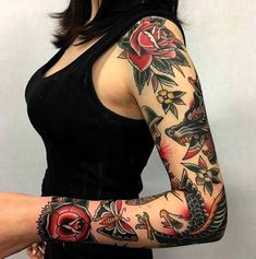 a woman with tattoos on her arms and arm