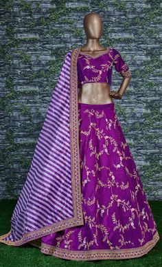 This elegantly designed bridal wedding Sabyasachi designer lehenga in dual-tone mulberry silk is further enhanced with badla, sequins, thread, and dori work all over.
Accompanied by a matching embellished Mulbury Silk choli along with matching white purple stripes printed khadi Organza dupatta which adds ease to the final look.
the lehenga and choli making it look mesmerizingly beautiful. This lehenga is semi-stitched and can be customized up to 42 sizes. Purple Chanderi Anarkali Set For Reception, Purple Silk Sharara For Navratri, Purple Chanderi Sharara For Reception, Purple Art Silk Sharara With Dori Work, Purple Floor-length Traditional Wear For Navratri, Purple Silk Sets For Reception, Purple Chanderi Lehenga For Reception, Purple Silk Lehenga For Reception, Purple Chanderi Sharara With Pallu