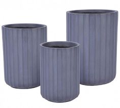 three gray vases sitting next to each other