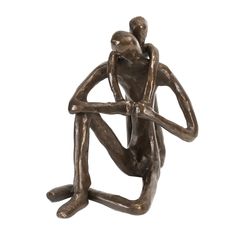 a bronze statue of two people holding each other's arms and legs, sitting on the ground