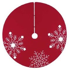 a red ornament with white snowflakes on it