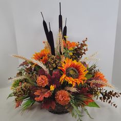 a basket filled with lots of different types of flowers