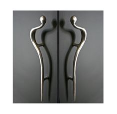 two metal handles are shown in this image