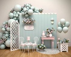 a room filled with balloons and furniture next to a wall