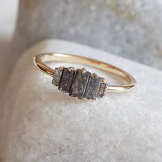 a close up of a ring on a rock