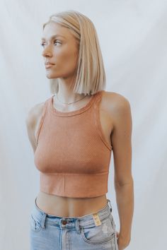 Vintage Chevron Highneck Crop Top One Size A ribbed knit crop top featuring high neckline and vintage wash. 92% Nylon / 8% Spandex Made in USA Trendy Cropped High Stretch Tank Top, Trendy High Stretch Cropped Tank Top, Summer Athleisure Ribbed Crop Top, Summer Ribbed Athleisure Crop Top, Trendy Summer Crop Top With Ribbed Neckline, Spring Ribbed Crop Top In Athleisure Style, Spring Ribbed Athleisure Crop Top, Spring Athleisure Ribbed Crop Top, Ribbed Crop Top For Workout In Spring