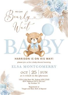 a baby shower with a teddy bear holding a blue balloon and some flowers on it