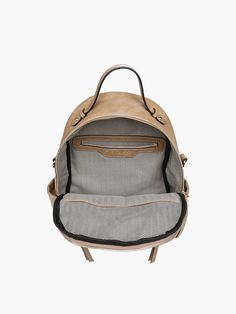 This backpack does it all! Lillia is a convertible style that can be worn like a traditional backpack or as a shoulder bag. It features plenty of places to store your belongings: a large main compartment, a front snap pocket, a dual zip pocket,side zip pockets, and a back zip pocket. It includes an adjustable/removable strap, and the backpack straps are adjustable. Made of vegan leather. Dimensions: 10"L x 12.5"H x 4"D Color: Taupe Vegan Leather Backpack, Mantra Bands, White Backpack, Convertible Backpack, Pocket Top, Backpack Straps, Large Backpack, Wallet Accessories, Guitar Strap