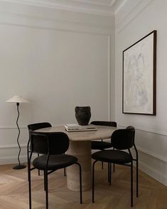 a dining room table with chairs around it