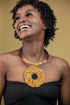 Unique African Maasai Handcrafted Beaded Necklace with an Elegant Look and Brilliant Finish. Color - Black and Mixed Color Beads. Length (Around Neck) - 17 Inches/ 43.2 Centimeters. Length (Downwards) - 4.5 Inches / 12 Centimeters. **GET FREE SHIPPING FOR ADDITIONAL ITEMS PURCHASED. Yes, Buy Multiple Items and pay shipping for 1 item only- The rest ships Free. (No Limits on the number of Multiple items). With a faster delivery time of 3 days via DHLExpress, Worldwide. Ordinary/Standard Shipping Traditional Red Necklaces With Black Beads, Traditional Red Necklace With Black Beads, Traditional Beaded Necklace With Polished Round Pendant, Traditional Beaded Necklace With Round Pendant, Red And Black Beaded Necklace For Festivals, Festival Large Beaded Round Necklaces, Beaded Necklaces With Round Pendant For Festivals, Red Jewelry With Black Beads For Festival, Festival Red Jewelry With Black Beads