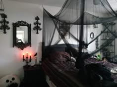 a bedroom decorated in black and white for halloween