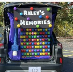 the back end of a car with a sign on it that says riley's memories