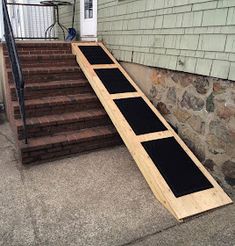 a set of steps leading up to a door on the side of a house that is being built