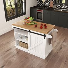 a kitchen island with cutting board and fruit on it