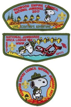 two patches depicting snoopy and the words national lumber festival, with cartoon characters on them