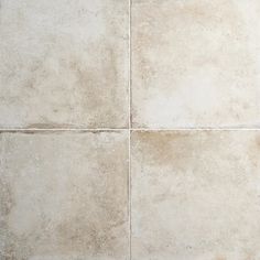 a white tile floor with four squares in it