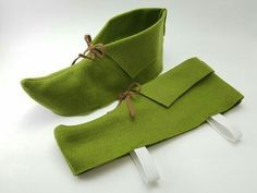 a pair of green shoes with ties tied to them