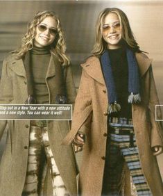 two women in coats and scarfs holding hands