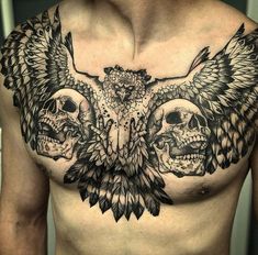 a man with two skulls on his chest and an eagle in the middle of it