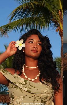 Beautiful Brown girl with curly black hair and a white flower tucked behind her ear Polynesian Curly Hair, Pacific Islander Hairstyles, Flower Behind Ear Hair, Islander Hairstyles, Flower Tucked Behind Ear, Tropical Flower In Hair, Flower In Hair Black Women, Tucking Hair Behind Ear Reference, Hibiscus Flower In Hair