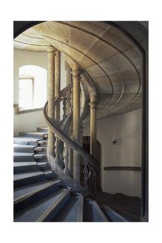 a spiral staircase in an old building