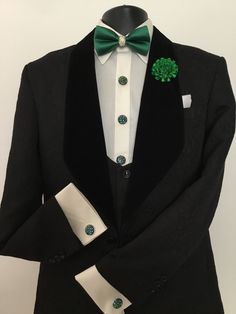 Our 3 piece black tuxedo, the latest addition to our family of wedding and special event attire, will make heads turn. This 3 piece tux includes a bow tie, boutonnière, button covers, and cufflink sets of your choice. Bespoke Black Tuxedo For Black Tie Events, Bespoke Black Tuxedo For Black-tie Events, Black Fitted Tuxedo For Ceremony, Black Tuxedo Suit For Ceremony, Luxury Black Suit And Tie Accessories For Groom, Elegant Green Groom's Tuxedo, Luxury Black Suit And Tie Accessories For Wedding, Elegant Green Tuxedo For Groom, Bespoke Black Tuxedo For Party