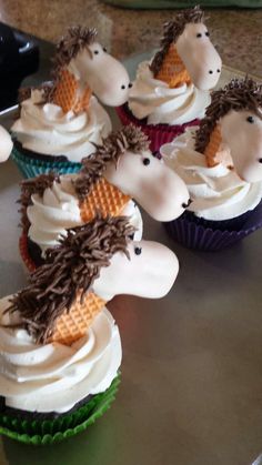 cupcakes decorated like hedgehogs with white frosting