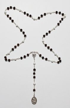 St. Joseph Chaplet Brown Glass Beads on Chain Saint Joseph Rosary, Saint Joseph Chaplet, Saint Joseph, Holy Family, St. Joseph This chaplet consists of 15 groups of beads, each group having 1 white and 3 brown beads. At the end there is an additional group and also 1 extra brown bead. On the white beads is recited the Hail Mary while one meditates on a mystery of the rosary. On each brown bead one says: Praised and blessed be Jesus, Mary and Joseph. Thank you for looking at the item and please feel free to ask any question regarding the item. Payment & Return policy 1. We only accept payment by PayPal 2. We offer a 100% full money back policy (with shipping included) for all buyers. If you don't receive the items, please contact us first and we will solve the problem ASAP. You are entitled White Spiritual Jewelry With Black Beads, Mystery Of The Rosary, Jesus Mary And Joseph, Saint Joseph, Hail Mary, Holy Family, St Joseph, White Beads, Bosnia And Herzegovina